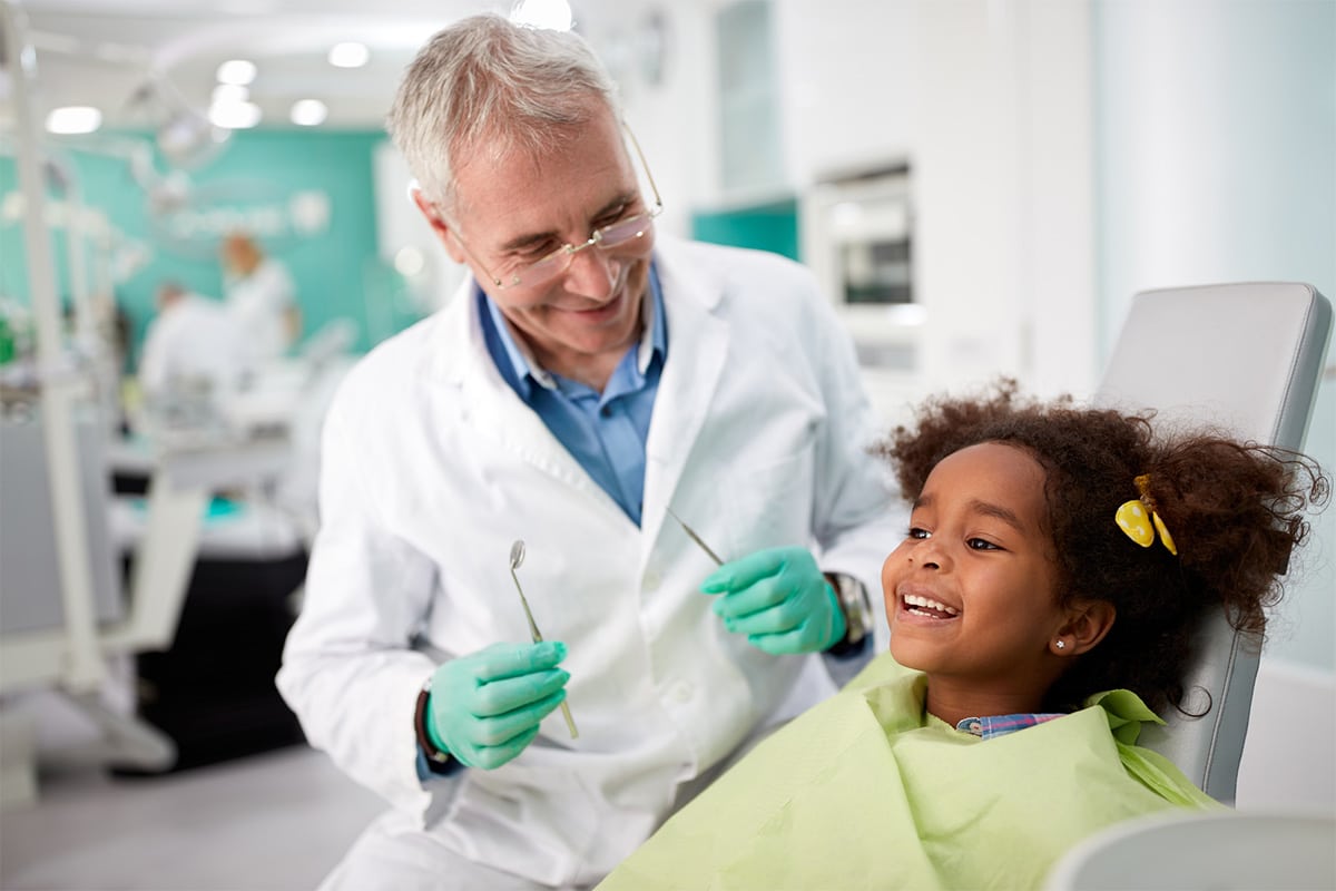 Dentist with child in chair image